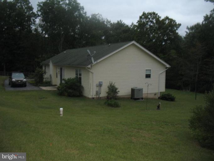 225 Barstow Road Prince Frederick, MD 20678 - Photo 9 of 10 a view of a house with backyard and garden