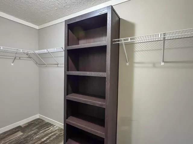 a hallway that has a bed in it