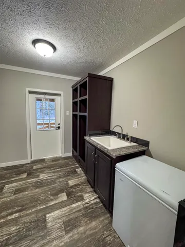 a kitchen with a stove and a refrigerator