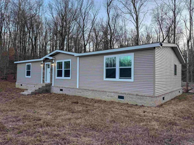 a house with trees in the background