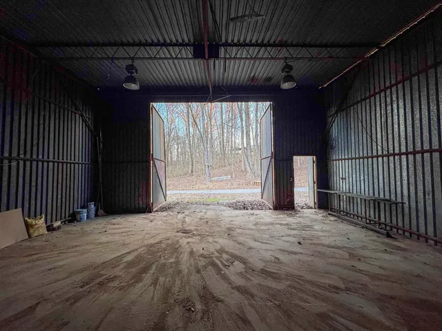 an empty room with wooden floor