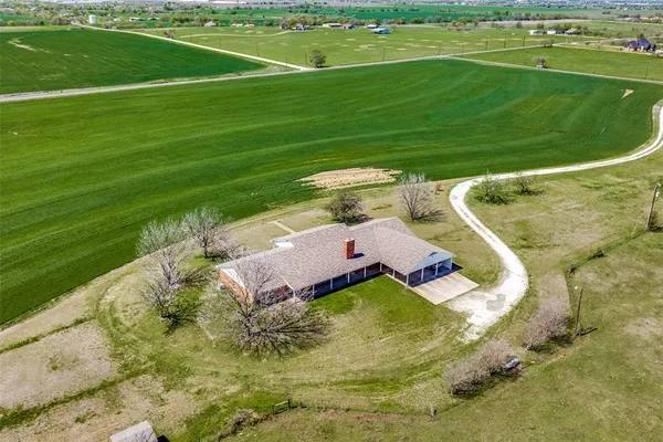 a view of a lake with a yard