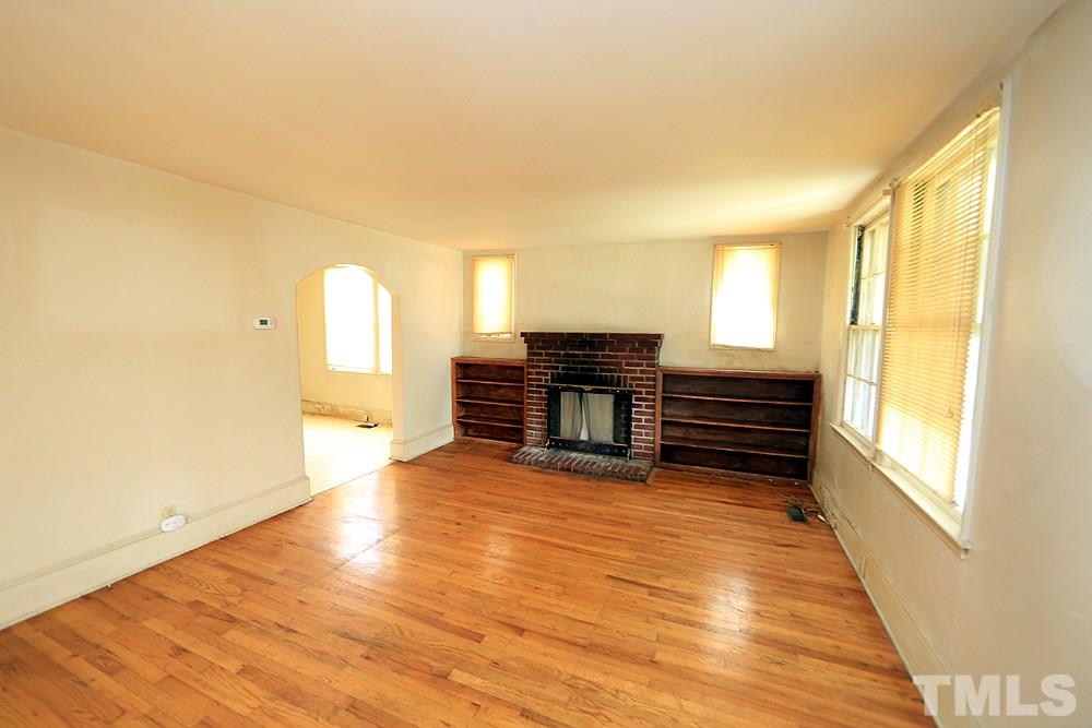 206 South Pettigrew Street Raleigh, NC 27610 - Photo 3 of 13 a view of livingroom with furniture wooden floor and windows