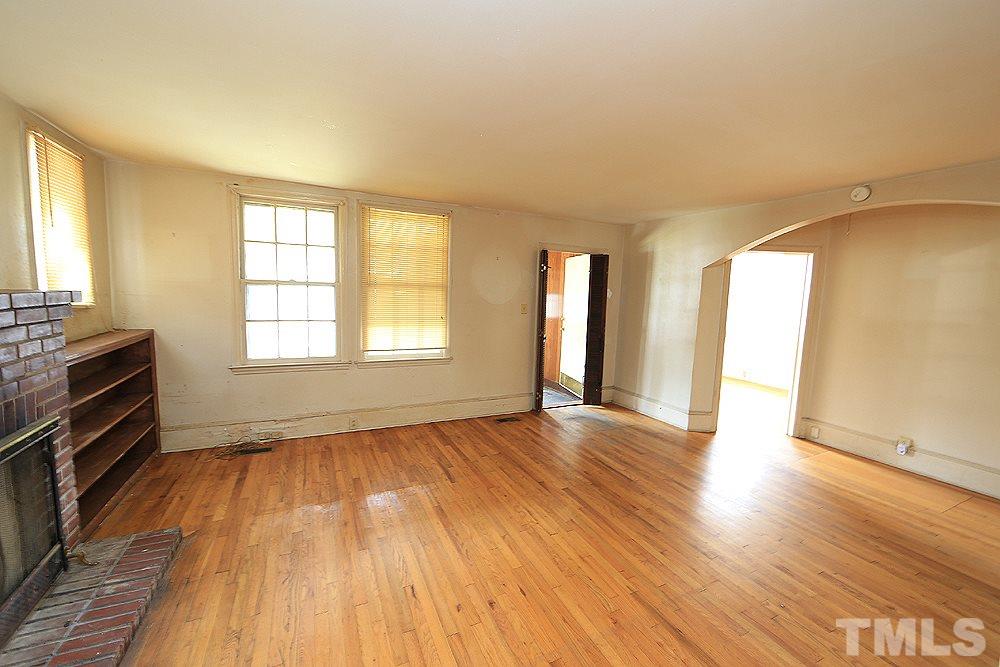 206 South Pettigrew Street Raleigh, NC 27610 - Photo 4 of 13 a view of an empty room with wooden floor and a window