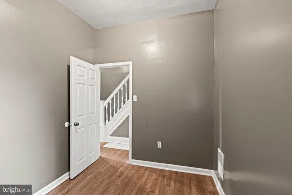 a view of an entryway with wooden floor