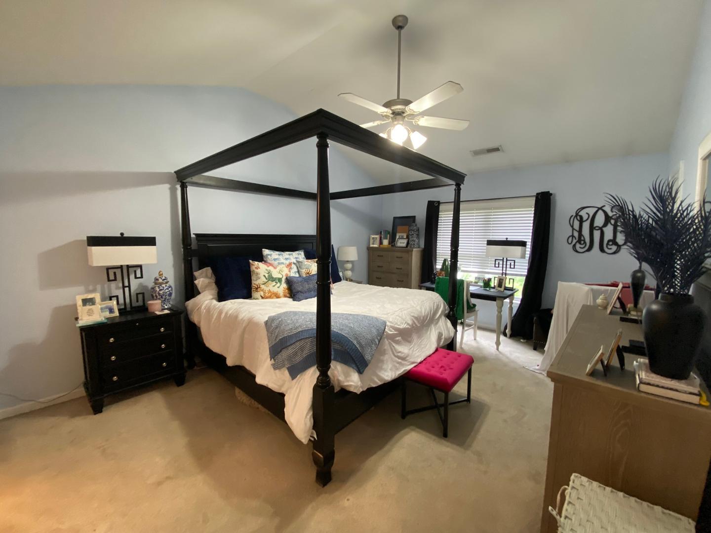 4646 Altha Street Raleigh, NC 27606 - Photo 11 of 23 a bed room with a bed window and dresser