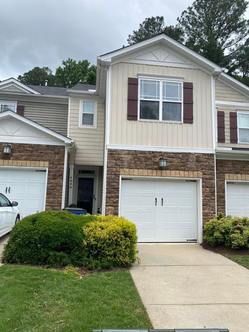 4646 Altha Street Raleigh, NC 27606 - Photo 2 of 23 a front view of a house with a yard and garage