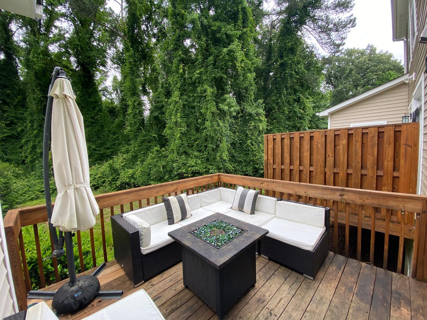 4646 Altha Street Raleigh, NC 27606 - Photo 21 of 23 a view of a wooden deck with furniture