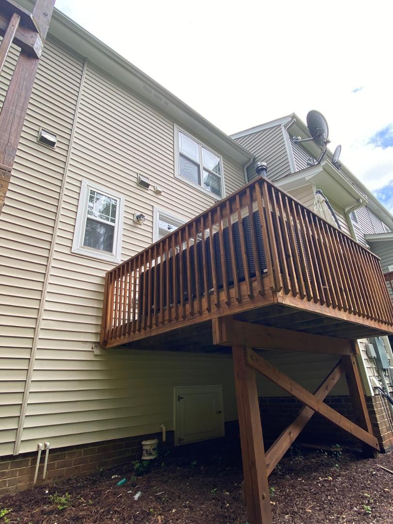 4646 Altha Street Raleigh, NC 27606 - Photo 23 of 23 a view of a deck with a table and chairs