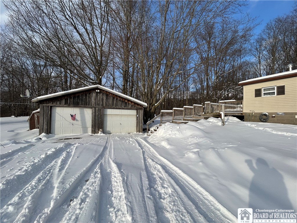 308 Ericsson Road Kennedy, NY 14747 - Photo 3 of 32 Garage leading to deck steps
