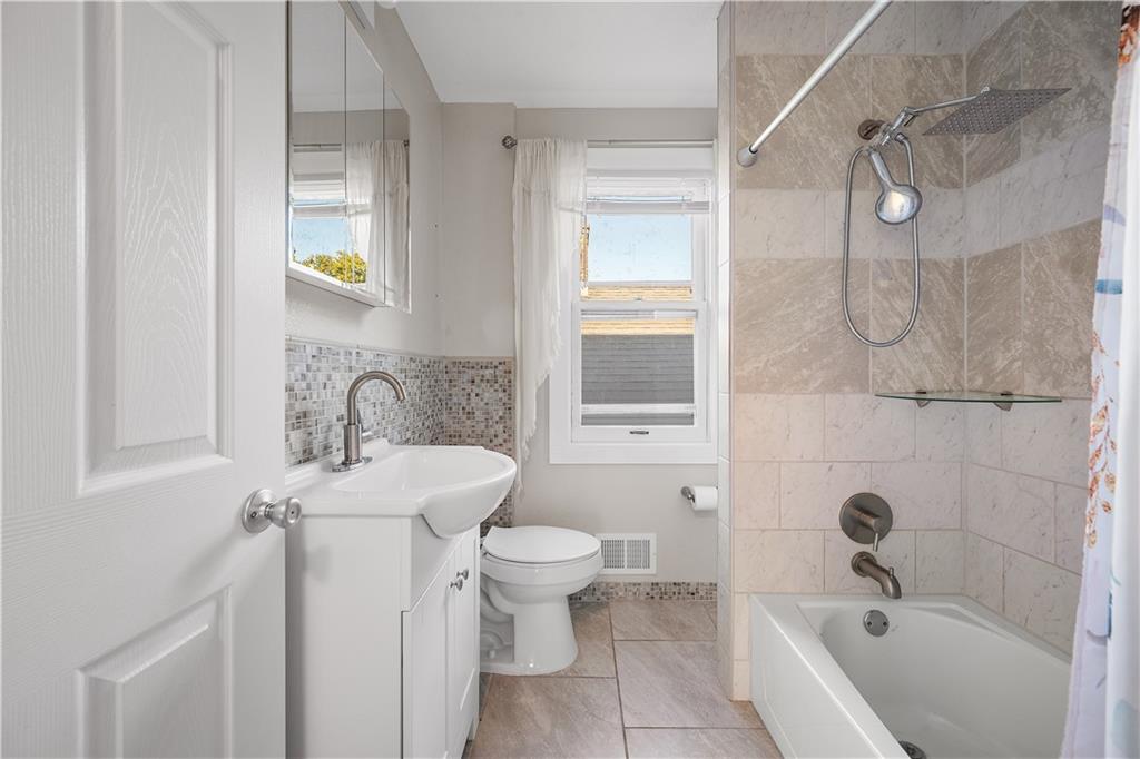 920 Watson Street Coraopolis, PA 15108 - Photo 19 of 36 a bathroom with a sink a toilet and shower