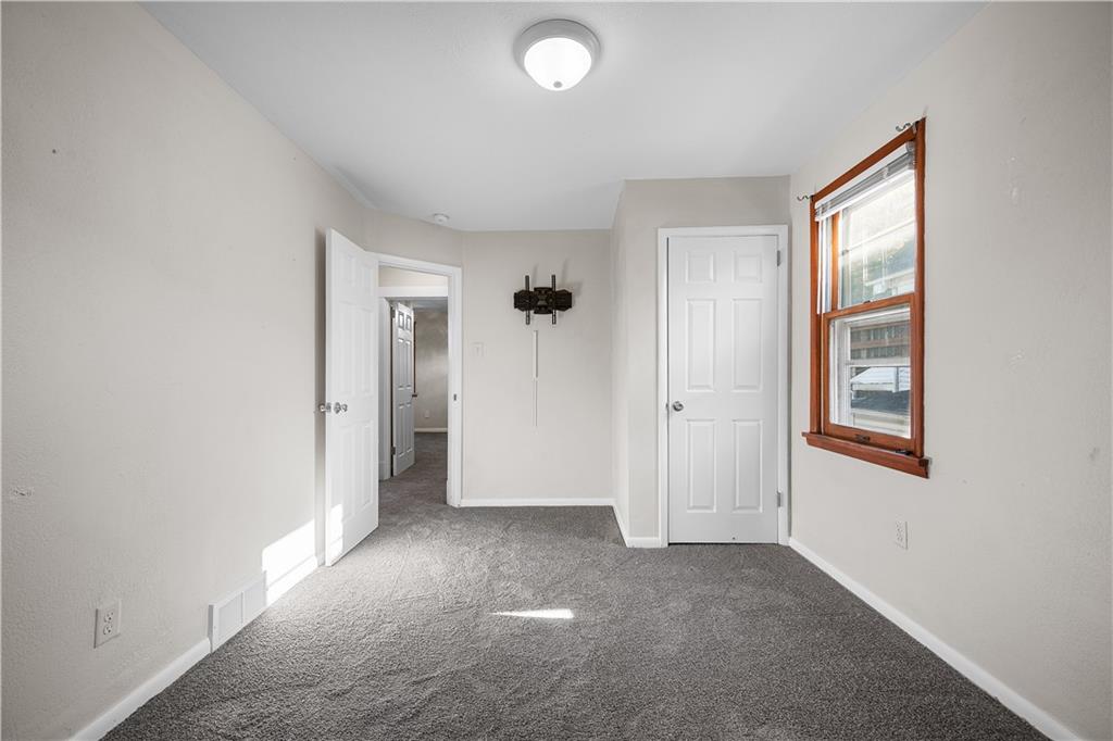 920 Watson Street Coraopolis, PA 15108 - Photo 23 of 36 an empty room with windows and closet