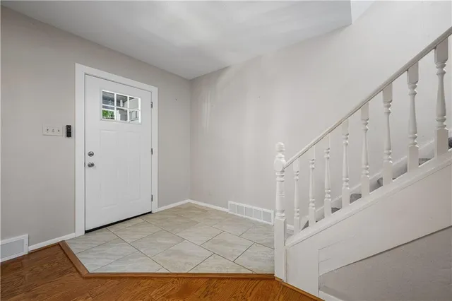 a view of a hallway with staircase