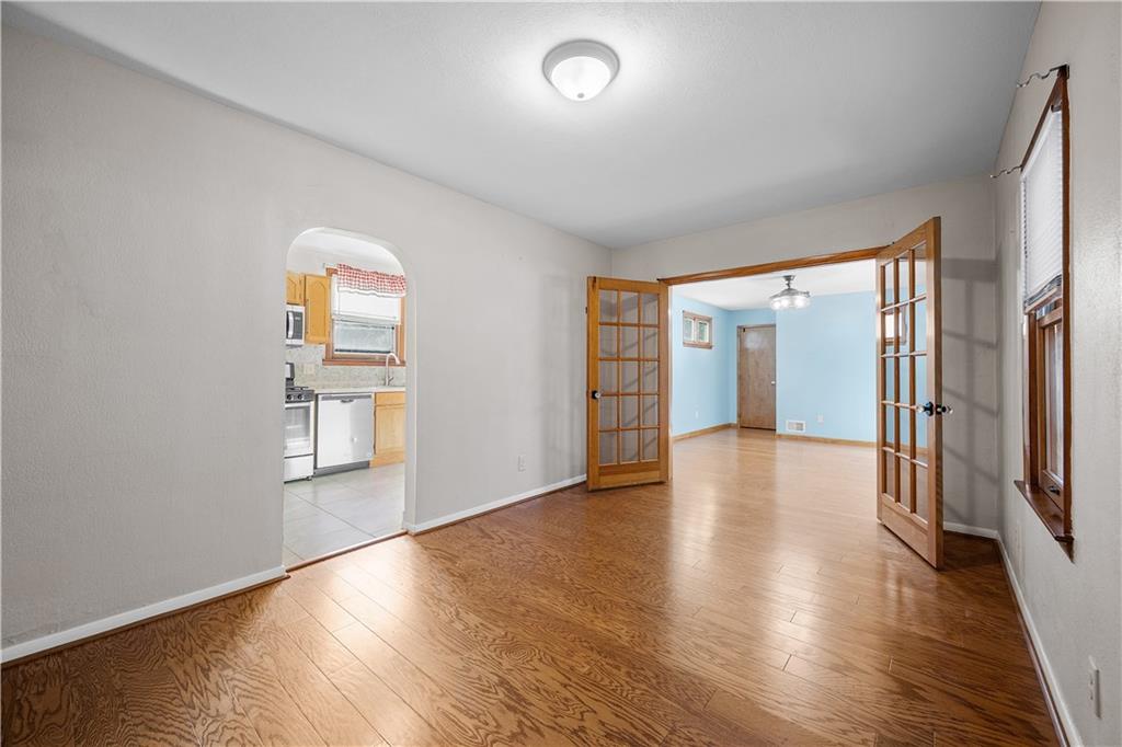 920 Watson Street Coraopolis, PA 15108 - Photo 9 of 36 an empty room with wooden floor and windows