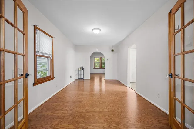a view of an entryway with wooden floor