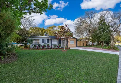 a view of a house with a yard