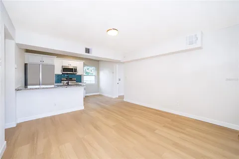 a view of a kitchen with furniture and a kitchen