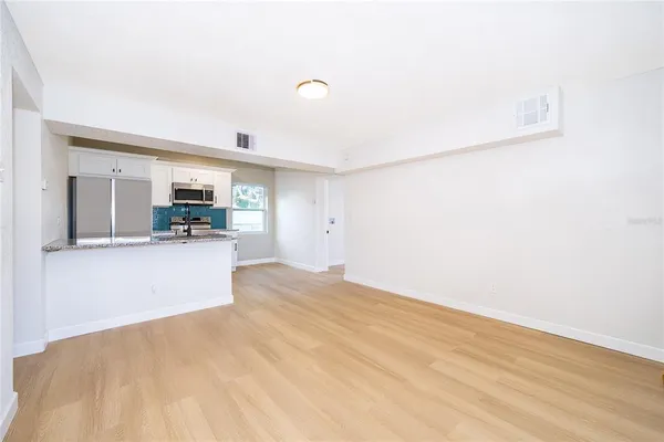 a view of a kitchen with furniture and a kitchen