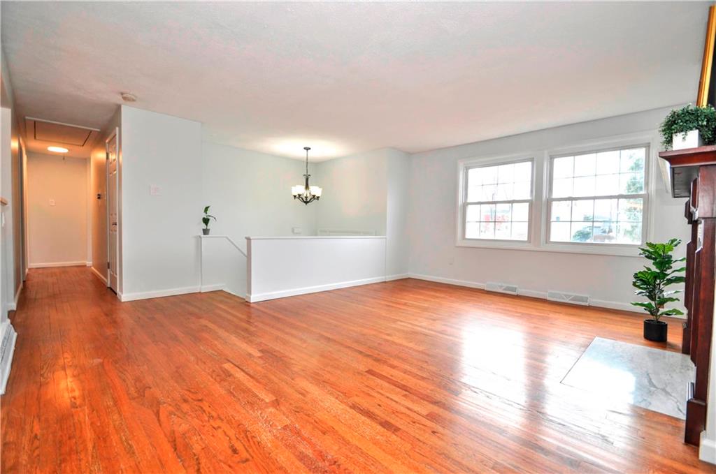 1313 Star Ridge Drive Pittsburgh, PA 15241 - Photo 4 of 36 a view of empty room with wooden floor and fan