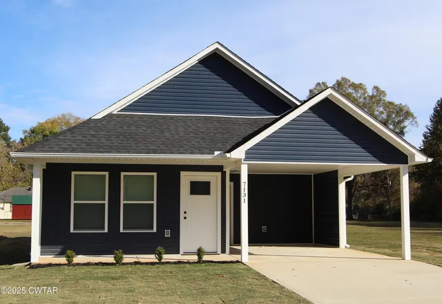 a kitchen with a sink stainless steel appliances and white cabinets