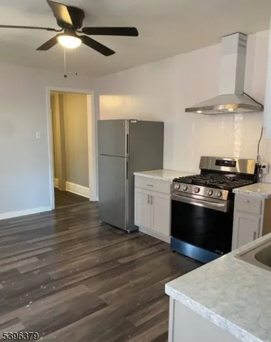 a kitchen with a stove and a refrigerator