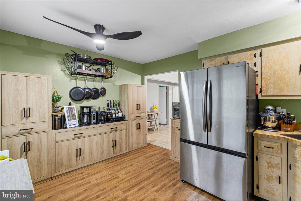 2116 Silver Court Hamilton, NJ 08690 - Photo 11 of 26 a kitchen with stainless steel appliances a refrigerator and wooden floor
