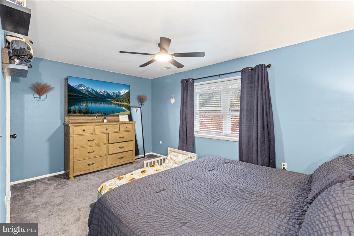 2116 Silver Court Hamilton, NJ 08690 - Photo 14 of 26 a bedroom with a bed and a dresser