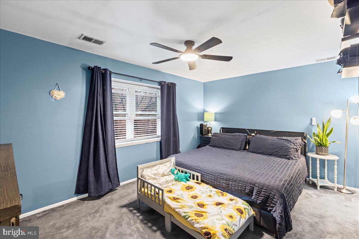 2116 Silver Court Hamilton, NJ 08690 - Photo 15 of 26 a bedroom with a bed and a window