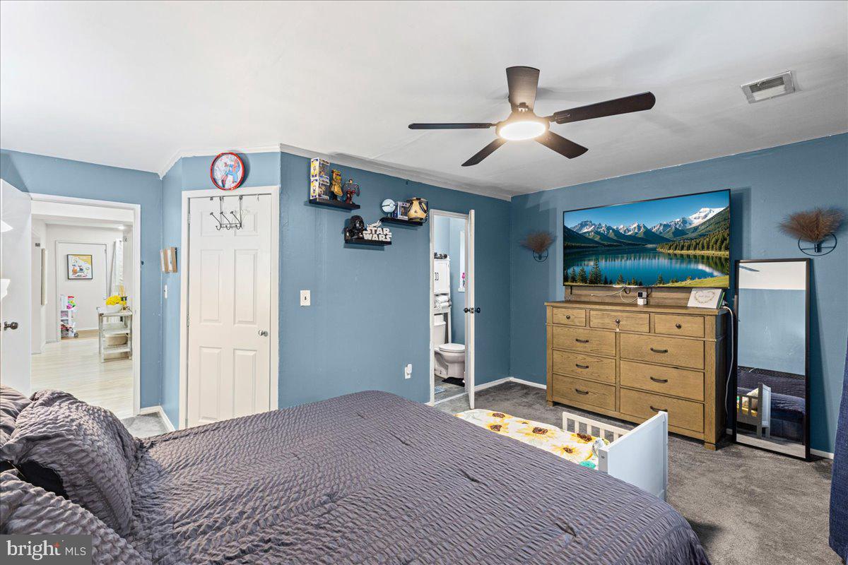 2116 Silver Court Hamilton, NJ 08690 - Photo 16 of 26 a bedroom with a bed and furniture