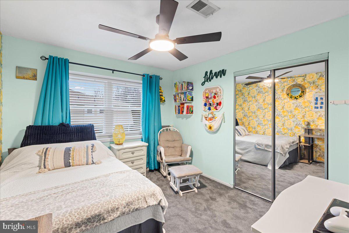 2116 Silver Court Hamilton, NJ 08690 - Photo 19 of 26 a bedroom with a bed and a table