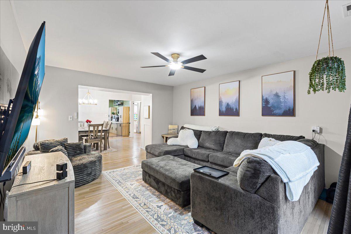 2116 Silver Court Hamilton, NJ 08690 - Photo 7 of 26 a living room with furniture and a flat screen tv