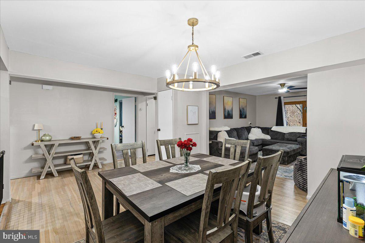 2116 Silver Court Hamilton, NJ 08690 - Photo 9 of 26 a view of a dining room with furniture and wooden floor
