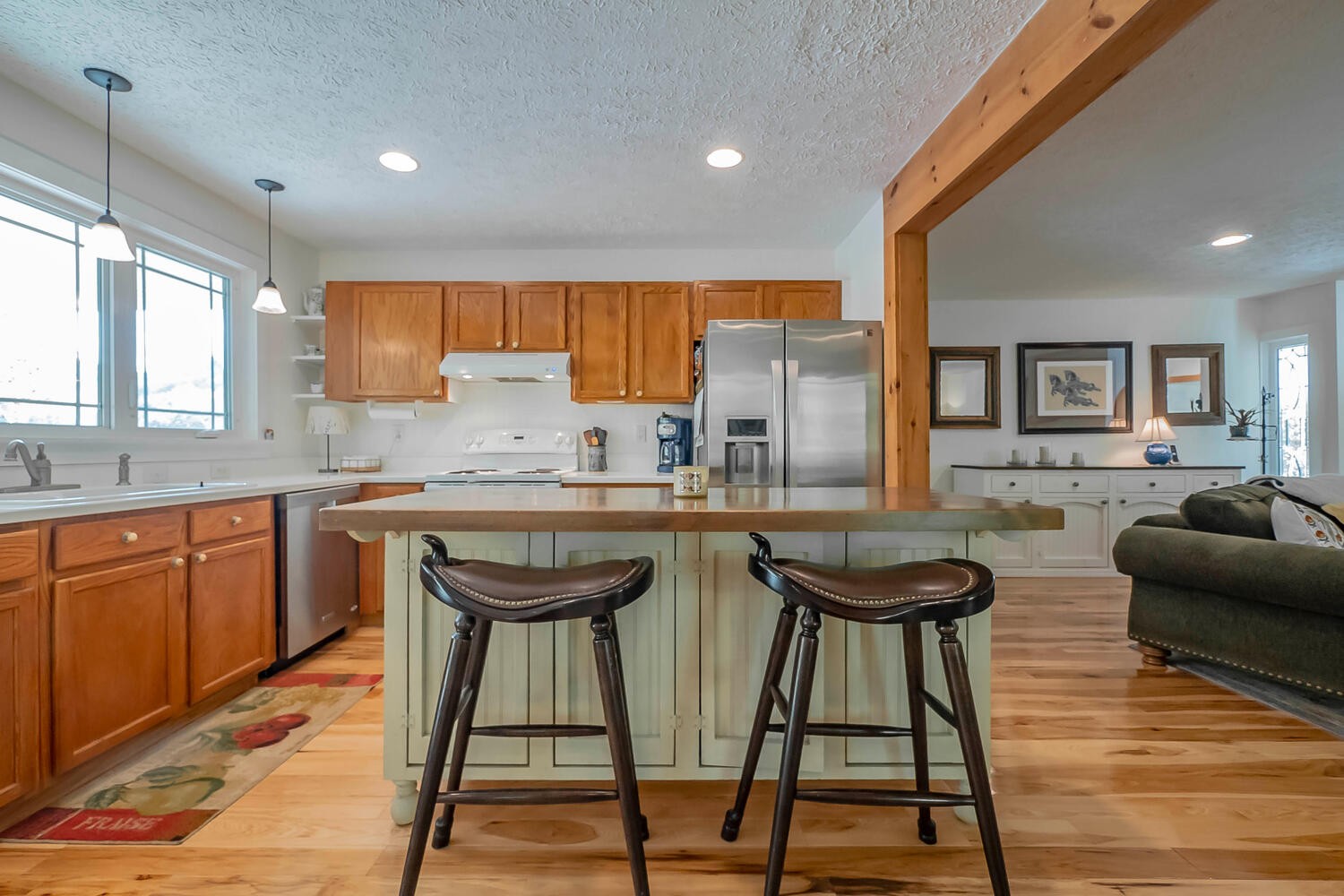 5970 Milton Fox Road Franklin, TN 37064 - Photo 11 of 49 a kitchen with stainless steel appliances granite countertop wooden floor sink table and chairs