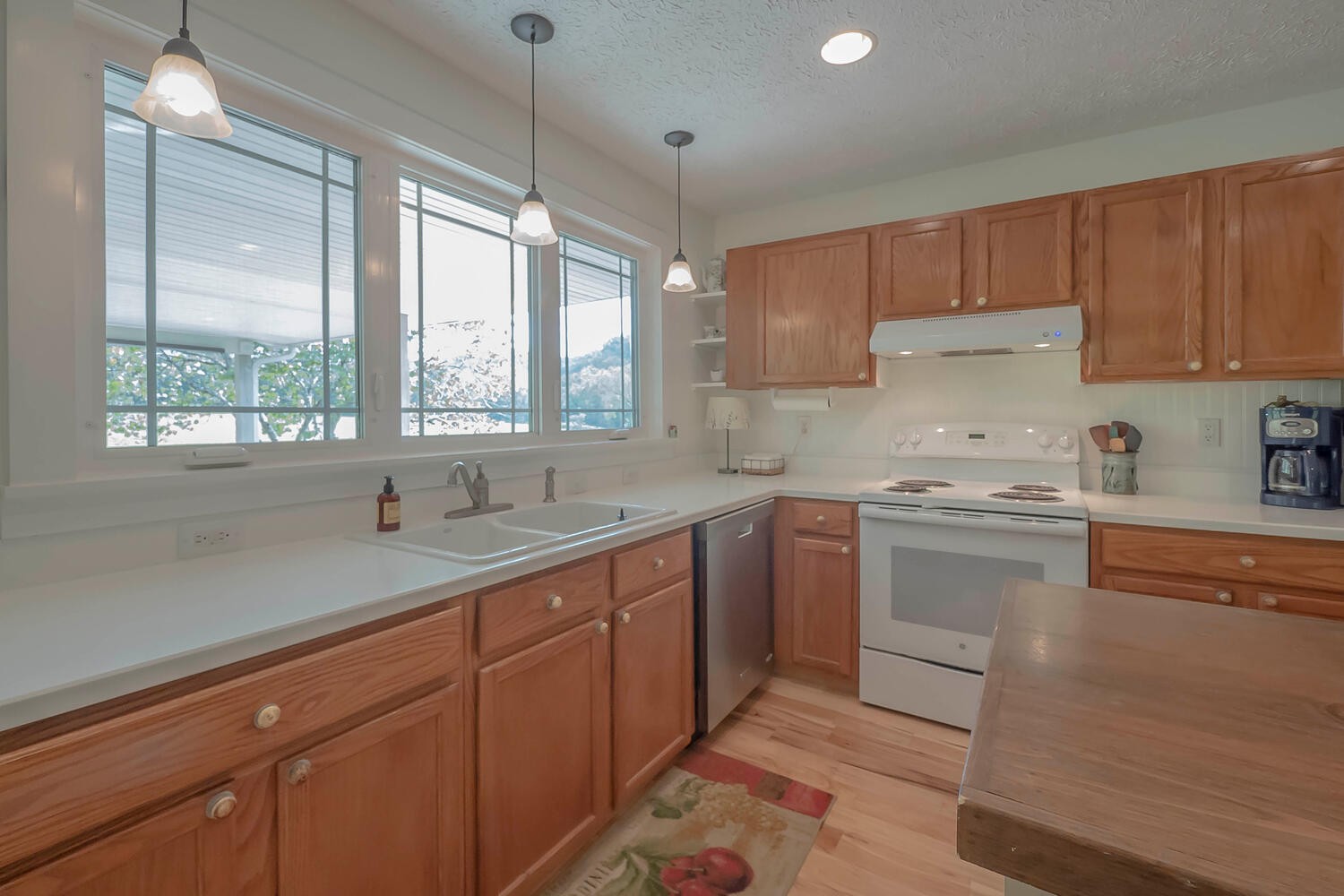 5970 Milton Fox Road Franklin, TN 37064 - Photo 12 of 49 a kitchen with a sink window and cabinets