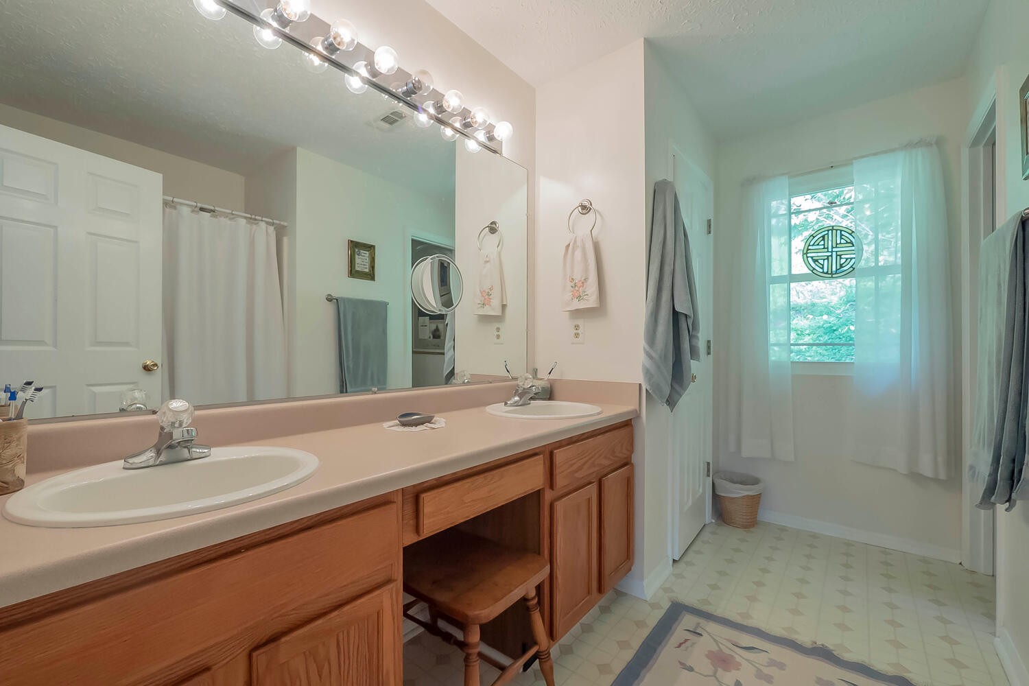 5970 Milton Fox Road Franklin, TN 37064 - Photo 18 of 49 a bathroom with a sink double vanity and a mirror
