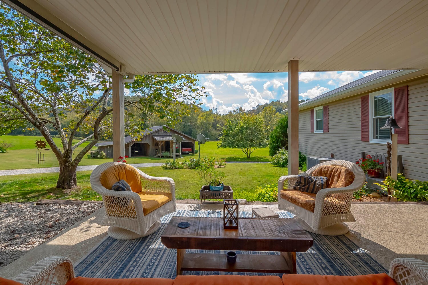 5970 Milton Fox Road Franklin, TN 37064 - Photo 3 of 49 a view of a patio with couches chairs and a yard