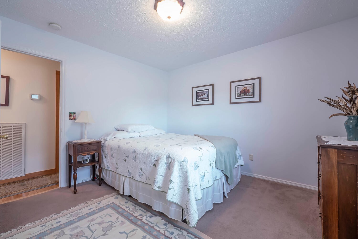 5970 Milton Fox Road Franklin, TN 37064 - Photo 23 of 49 a bedroom with a bed and wall painting