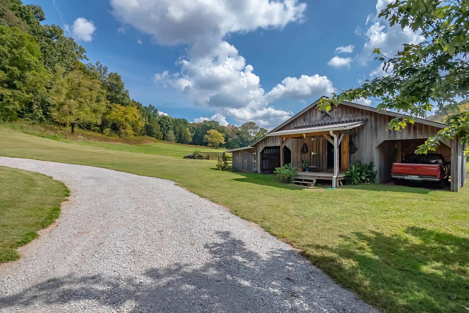 5970 Milton Fox Road Franklin, TN 37064 - Photo 34 of 49 a front view of a house with a yard and trees
