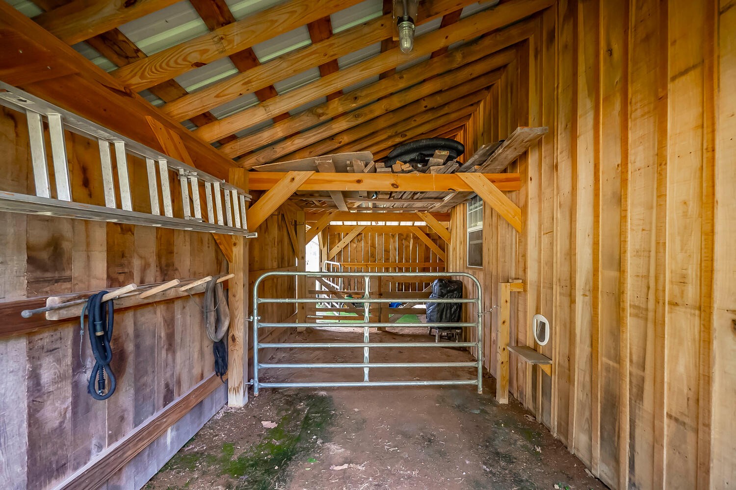 5970 Milton Fox Road Franklin, TN 37064 - Photo 38 of 49 a view of an empty room with wooden walls
