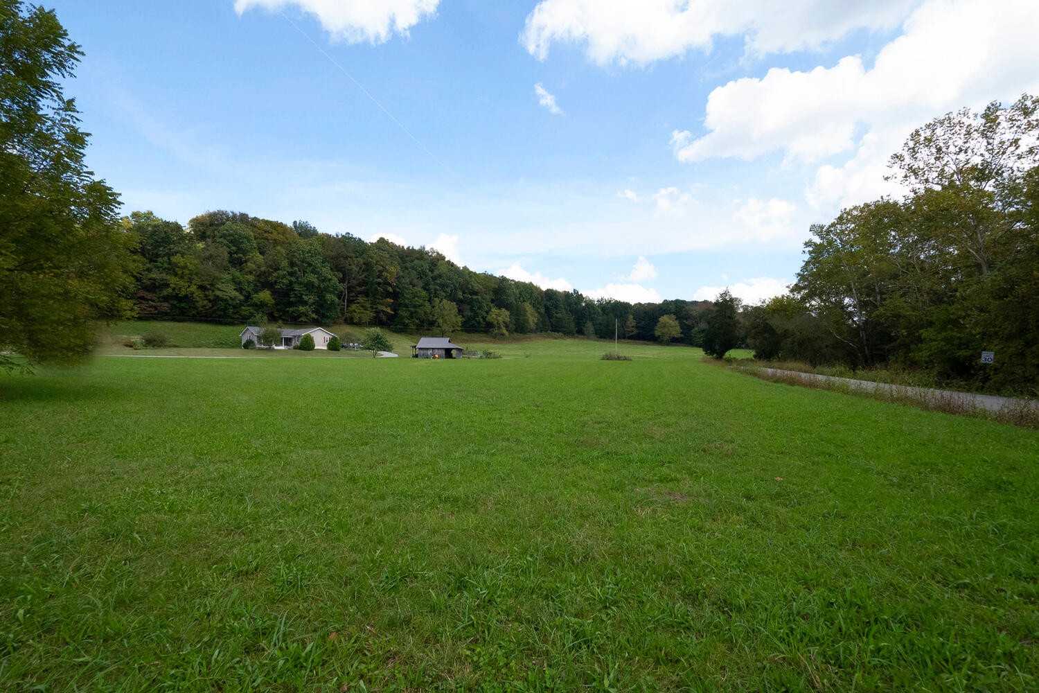 5970 Milton Fox Road Franklin, TN 37064 - Photo 40 of 49 a view of a green field with wooden fence