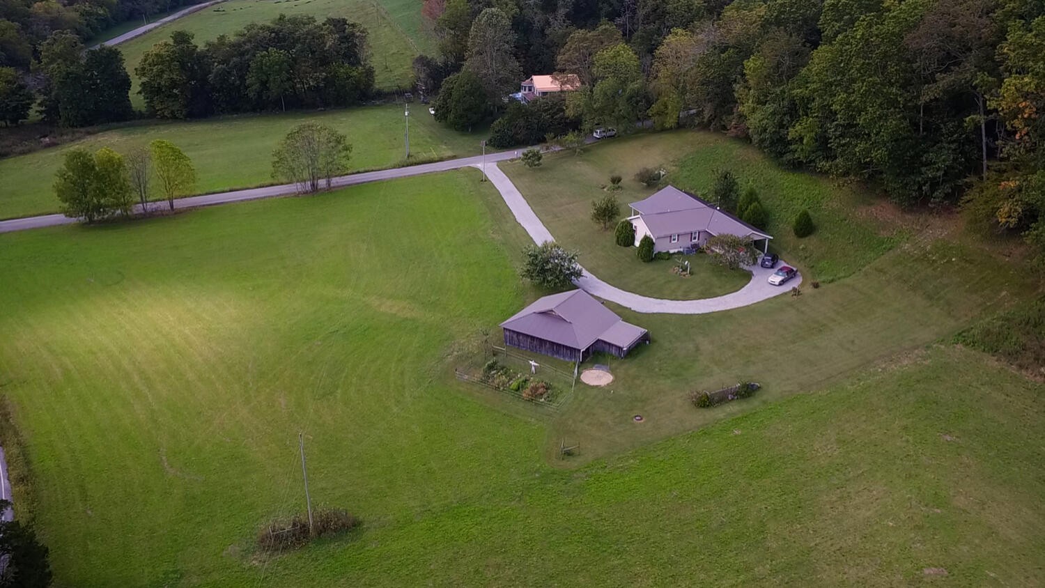 5970 Milton Fox Road Franklin, TN 37064 - Photo 46 of 49 an aerial view of a house with swimming pool and green space