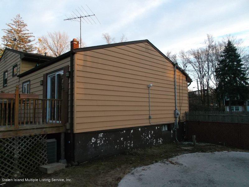 1 Sarno Street Colonia, NJ 07067 - Photo 20 of 30 a front view of a house with a yard