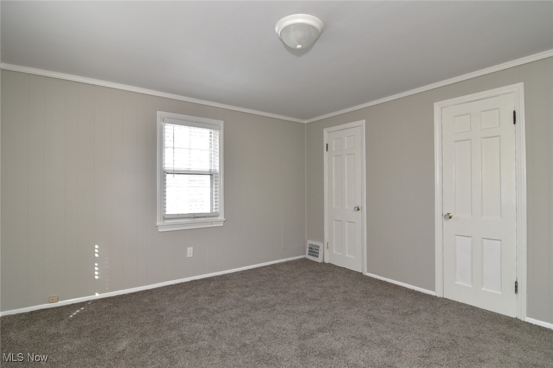 1443 Churchill Road Lyndhurst, OH 44124 - Photo 35 of 39 Unfurnished bedroom featuring ornamental molding and carpet