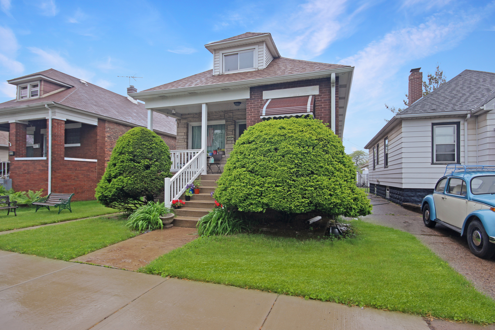2424 Birch Avenue Whiting, IN 46394 - Photo 2 of 48 a front view of a house with a garden