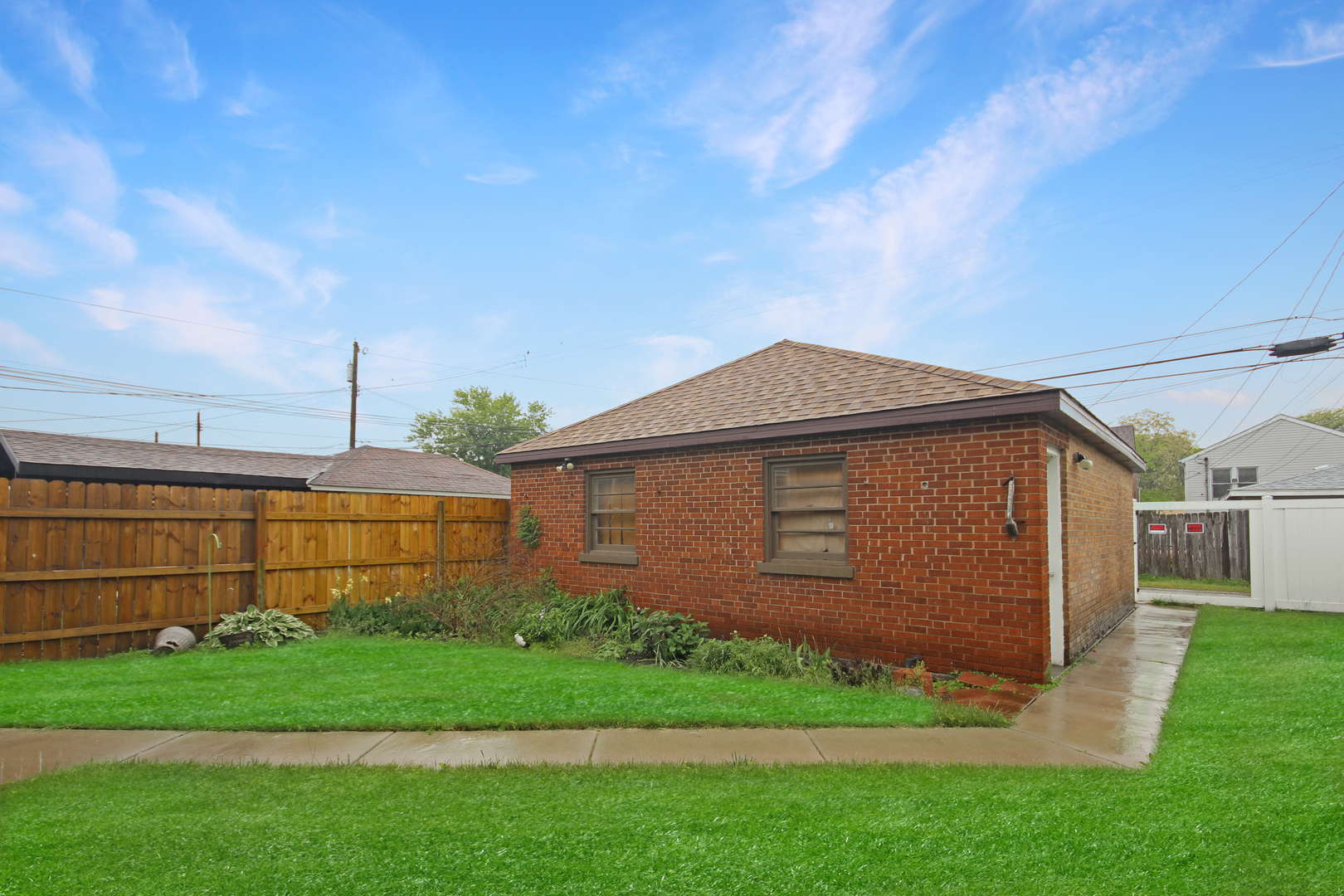 2424 Birch Avenue Whiting, IN 46394 - Photo 3 of 48 a front view of a house with a garden