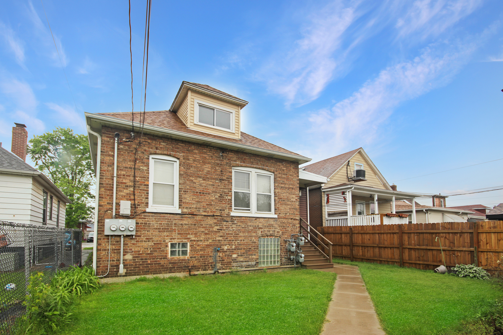 2424 Birch Avenue Whiting, IN 46394 - Photo 4 of 48 a front view of a house with a garden
