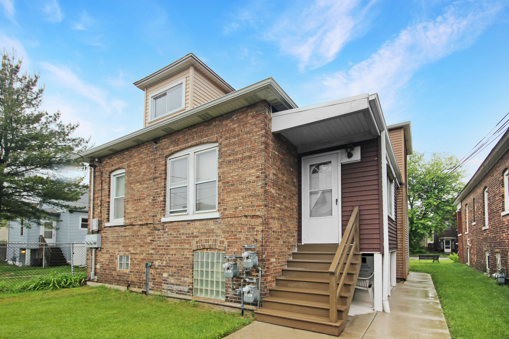 2424 Birch Avenue Whiting, IN 46394 - Photo 5 of 48 a front view of a house with garden