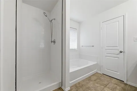 a white bath tub sitting next to a window