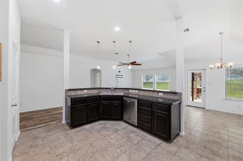 a kitchen with stainless steel appliances granite countertop a stove and a sink