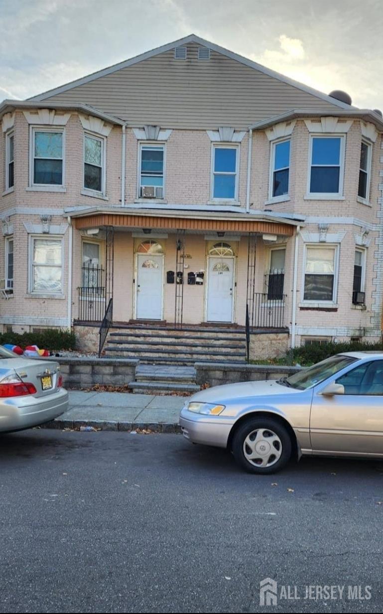 a car parked in front of a house